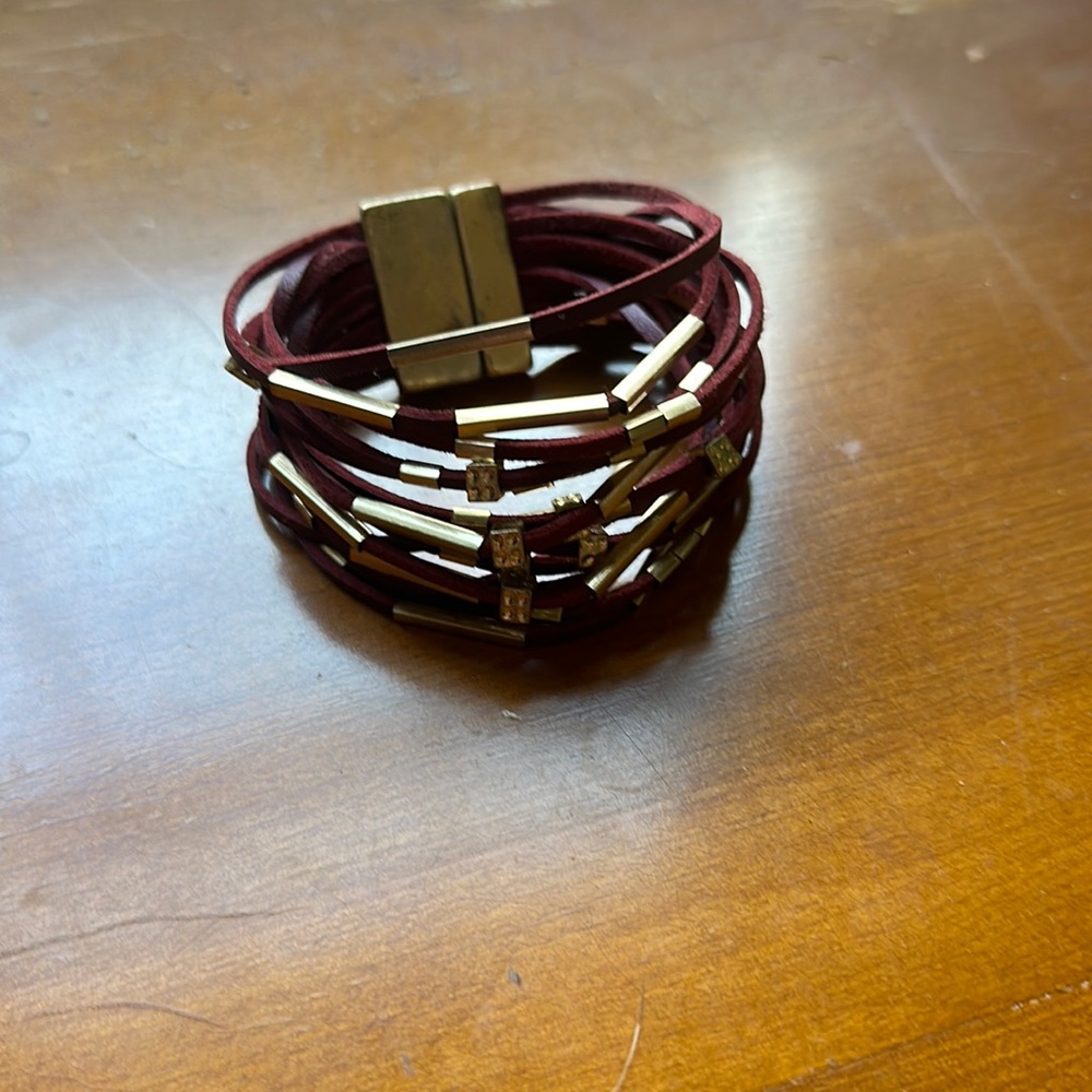 Cute red multi strand faux leather bracelet.